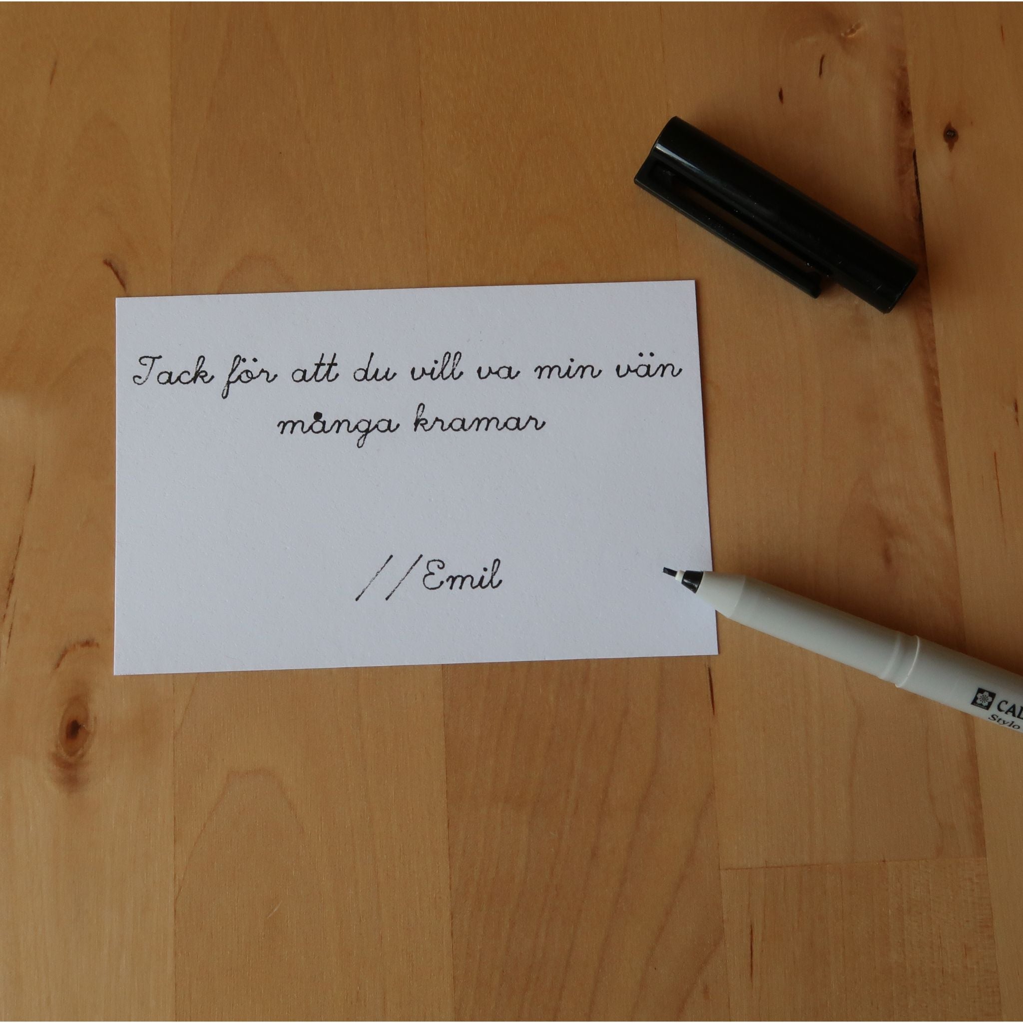 Hälsning skriven med penna